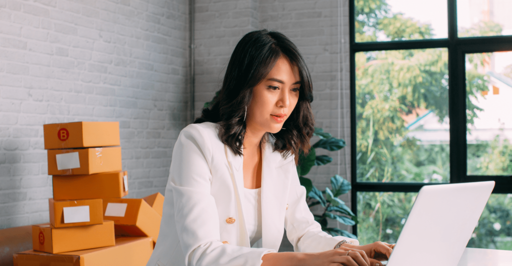 asian businesswoman in front of a computer